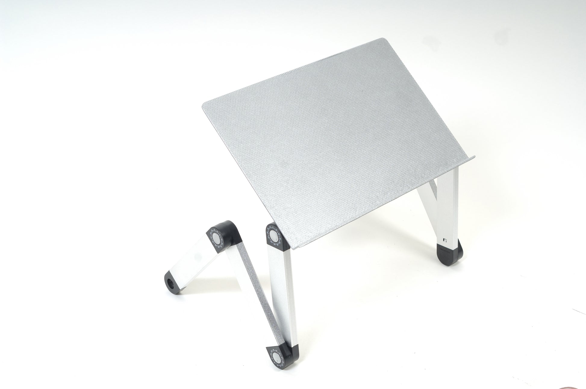 a silver laptop stand for desk that is also an adjustable laptop lap desk
